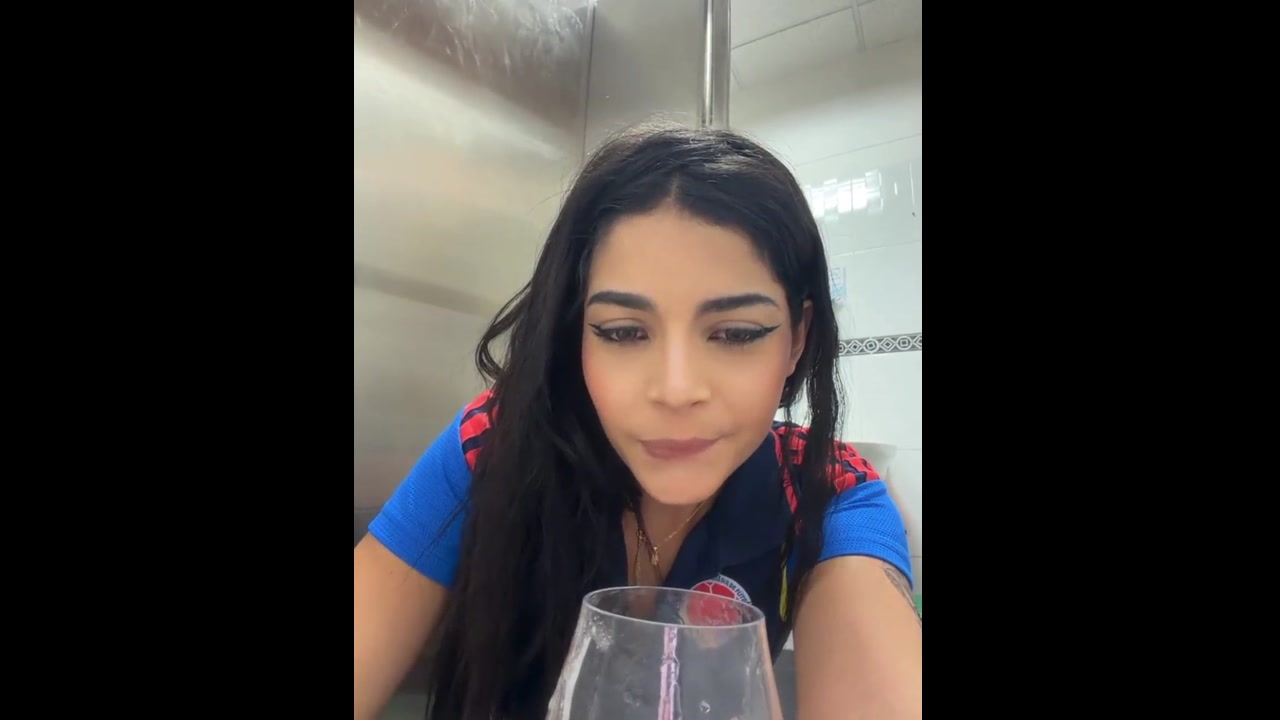 This Columbian chick in a public restroom fingering her pussy squirting in a glass and drinking it 01